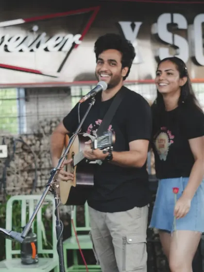 A happy moment on stage during an open mic performance. We love supporting new artists and giving them a platform.