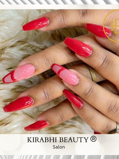 A bold and romantic set combining solid red nails with abstract red and pink French tip accent nails.