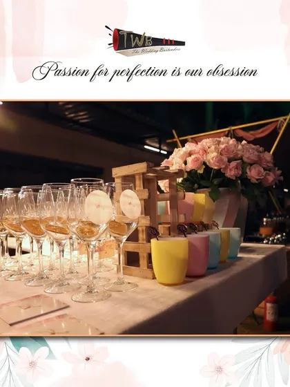 A stylish display of glassware for a Sangeet night, including custom tags and flamingo stirrers.