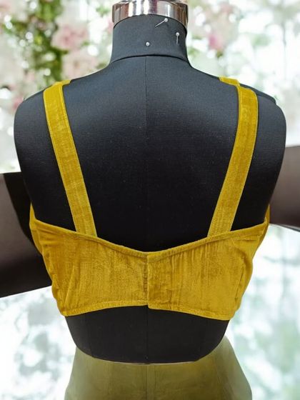 The back of our velvet corset features a clean, modern design with wide straps, offering both support and style. Customization is available in any color or fabric.