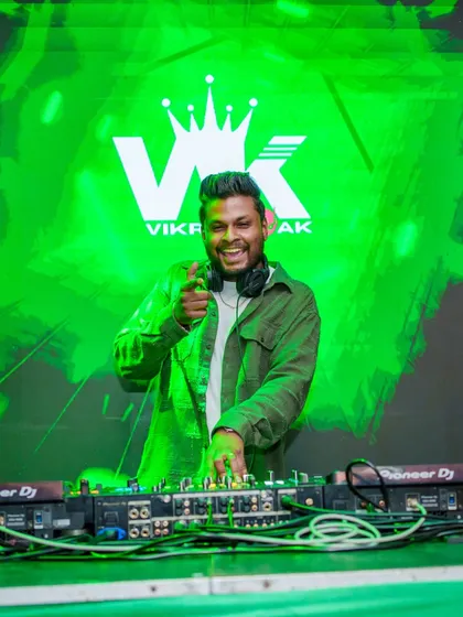 A great shot from a lit Thursday night at Happy Brew. With my logo lighting up the background, I'm in my element, mixing tracks and engaging with the crowd to create a high energy atmosphere.