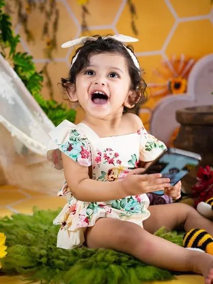 A bee-autiful smile from our little queen bee. This sunflower and honeybee theme is bright, cheerful, and full of happy energy.