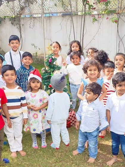 A collection of joyous moments from our Christmas party, including dancing, enjoying cupcakes, building a sand snowman, and posing for group photos.