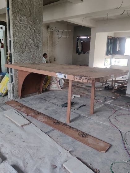 Before final construction, we built a full-scale plywood mock-up of the cantilevered dining table on site. This crucial step allowed us to test its structural integrity and ensure the weight was distributed evenly.