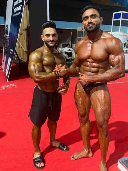 Brotherhood in bodybuilding. Shaking hands with a competitor.