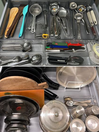 A complete view of a kitchen drawer system, showing organized utensils and cookware. This is the kind of functional beauty we aim to create in every project.