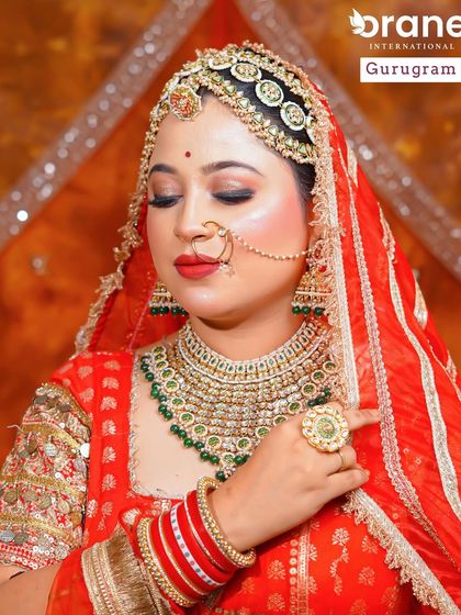 Another angle of the Rajasthani bride, showcasing the detailed eye makeup and classic red lip. These are timeless skills that are always in demand in the Indian bridal market.