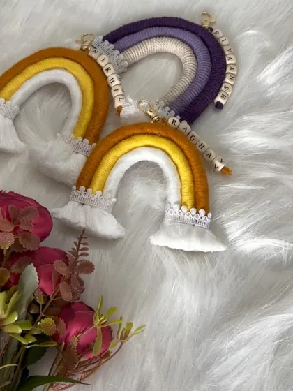 More custom rainbow keychains. The yellow and purple ones are sitting pretty, waiting to be packed.
