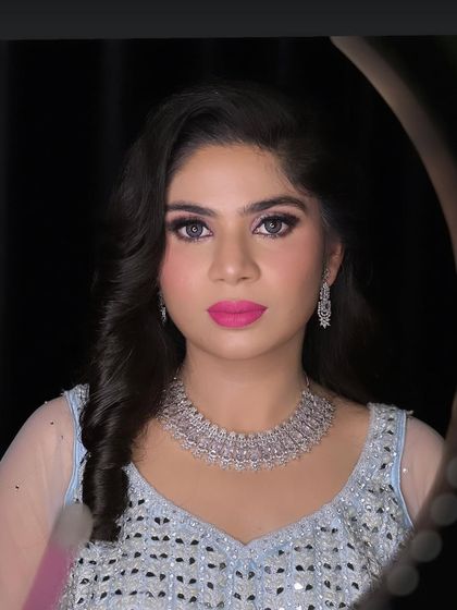 A full portrait of the engagement bride, showing her beautiful colored lenses and flawless makeup.