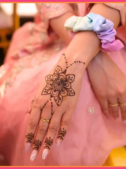 A close-up of a guest's elegant Mehendi design. We hire talented artists to create beautiful art for your guests.