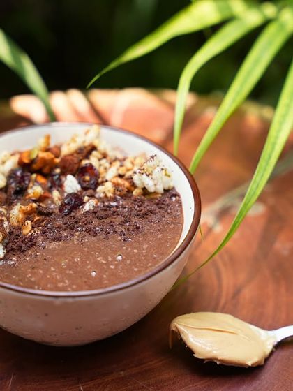 My PBC Smoothie Bowl is a powerhouse of flavor and nutrition. It blends peanut butter, banana, and chocolate into a creamy base, topped with granola and nuts for extra crunch.