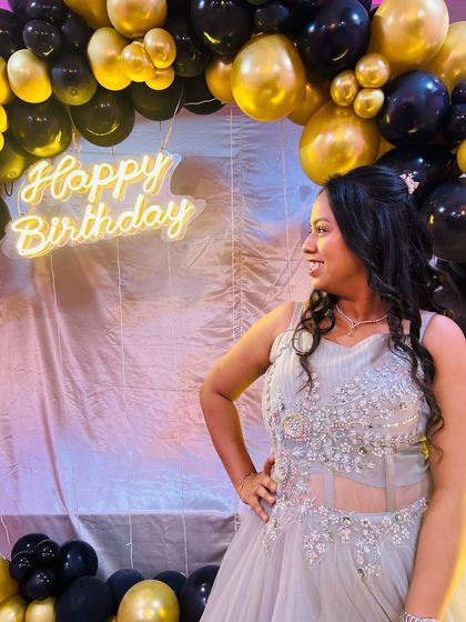 A candid shot of the client at her birthday party, enjoying her special day in our gown.