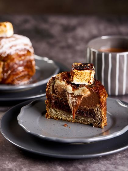 Our Hot Chocolate Croissant Cake is a modern classic, inspired by the simple joy of a cup of hot chocolate on a rainy day.