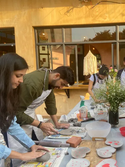 Couples and friends working together to create heart-themed pieces during our Clay-Love-Play Valentine's festival.