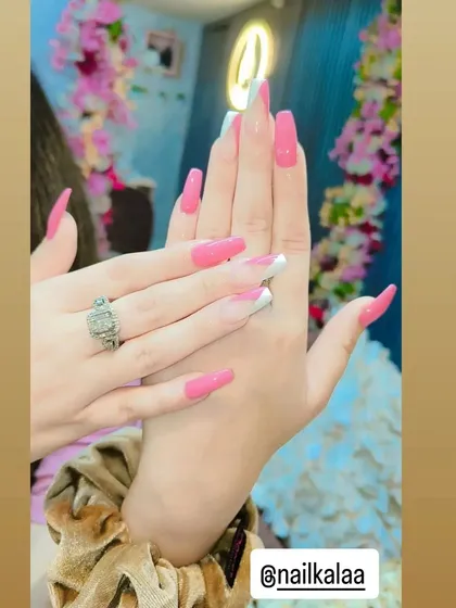 A playful and bold design combining solid bright pink nails with a classic white French tip on accent nails. This is a fun way to mix and match different styles.