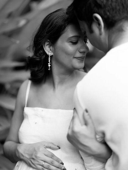 Another angle of their intimate embrace. This black and white photo focuses on her emotional expression, showing the love and trust she feels in this moment.