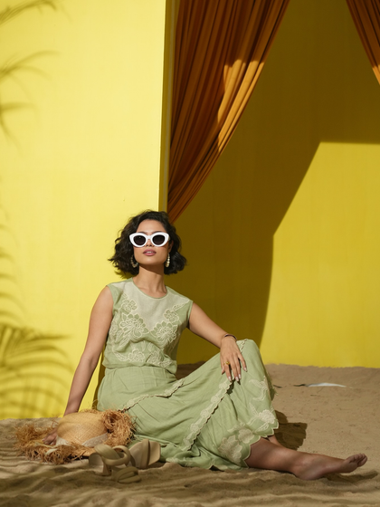 This image for Boho-Chic utilizes dramatic shadows from palm leaves to enhance the summery, golden-hour theme of the shoot.