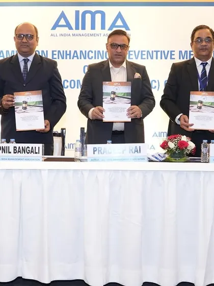 With fellow panelists at the AIMA event, launching the program materials for the seminar on CVC guidelines.