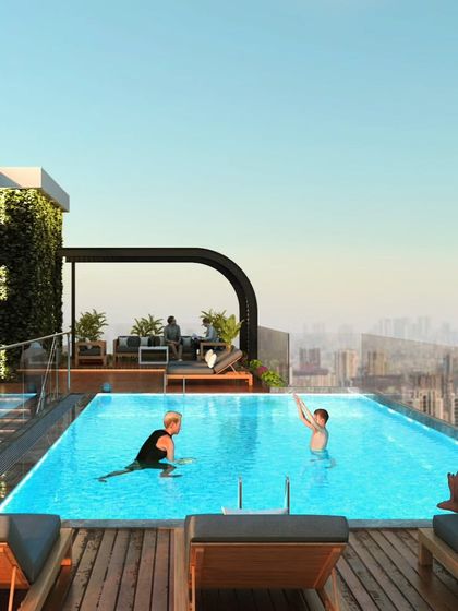 The rooftop infinity pool at Haresh Bhuvan, a residential project designed to offer urban tranquility and luxury living with stunning city views.