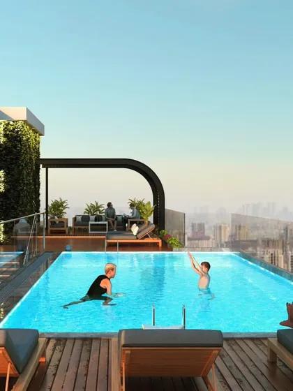 The rooftop infinity pool at Haresh Bhuvan, a residential project designed to offer urban tranquility and luxury living with stunning city views.