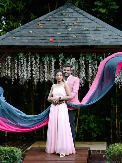 A beautiful shot of a flowing gown at the garden gazebo, with the fabric creating a stunning visual effect.