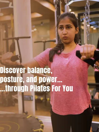 Discover balance, posture, and power. This client uses the reformer straps to work her arms and back, requiring core engagement to maintain a stable, seated position.