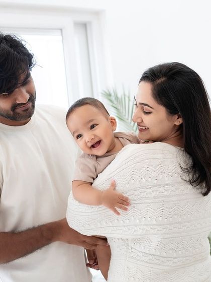 A happy family of three in the studio.