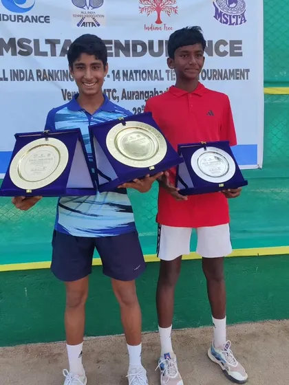 Tavish and his partner with their trophies after winning the doubles title at the U14 Nationals in Aurangabad.