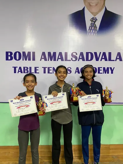 Our girl paddlers with their trophies and certificates from the 1st Thane District Ranking Tournament, where they secured medals in the U-15, U-17, and U-19 categories.