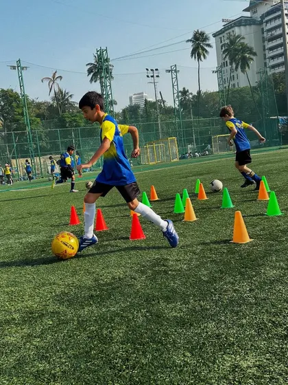 Football is the language we all speak. Here, our players are deep in a cone drill, mastering their dribbling skills.