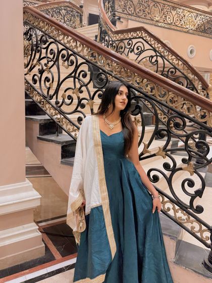 Looking away gracefully, this shot captures the flow and flare of the anarkali.