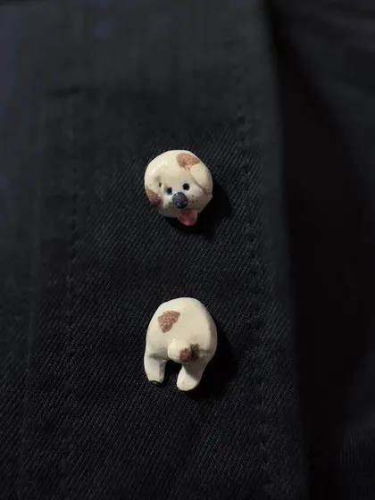 A playful two-part pin set of a spotted dog's head and tail. This is another example of the unique, wearable art I create for my animal-themed collection.