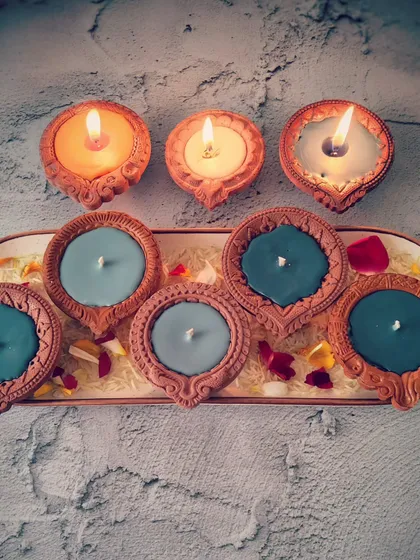 My tri-color Diya Candles, both lit and unlit, ready for the Ayodhya temple inauguration celebration. They are available in scented and unscented options to suit your preference.