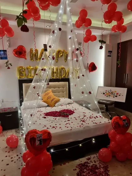 A full view of the enchanting red-themed romantic birthday surprise.