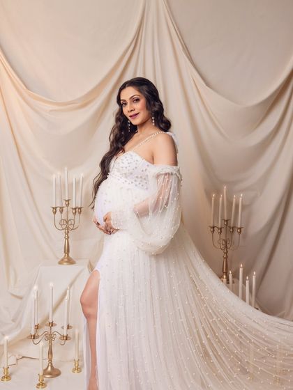 This pose showcases the magnificent train of the gown, creating a sense of grandeur and elegance.