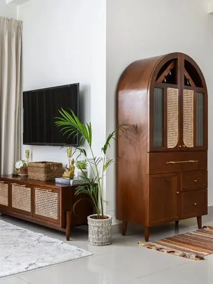 The Bagh collection, featuring a tall unit customized as a Pooja cupboard and a statement dining table with eight unconventional legs and brass accents. This shows how we can adapt our designs for different functional and aesthetic needs.