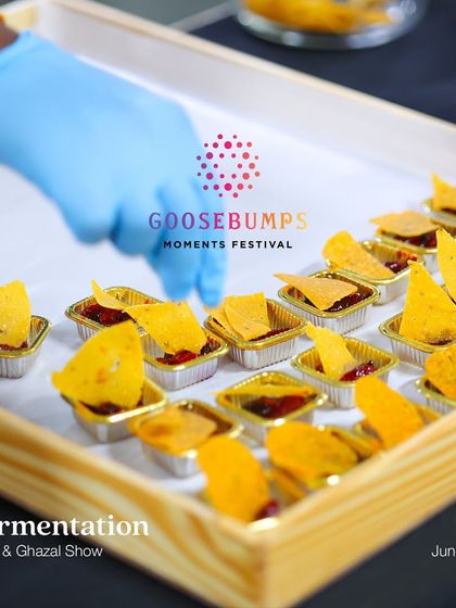 Preparing tasting samples for our Fermentation Food & Ghazal show. We paired our dips and pickles with nachos for a delightful culinary experience.