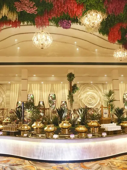 Imagine your wedding feast set under a canopy of flowers and crystal chandeliers. We design grand, opulent buffet displays that are not just meals, but stunning centerpieces for your celebration, promising a feast for the eyes and the palate.