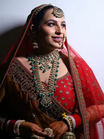 A profile shot of the bride, showcasing her beautiful smile and the intricate details of her jewellery.