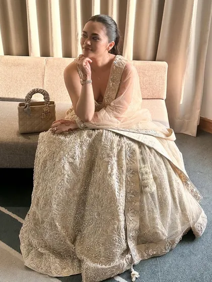 Another angle of our stunning champagne gold lehenga, showing off its beautiful flare and intricate detailing.