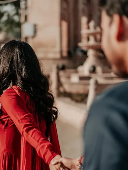 Another perspective of the "follow me" pose, creating a sense of being led into a shared future. It's a beautiful, symbolic shot for a pre-wedding album.