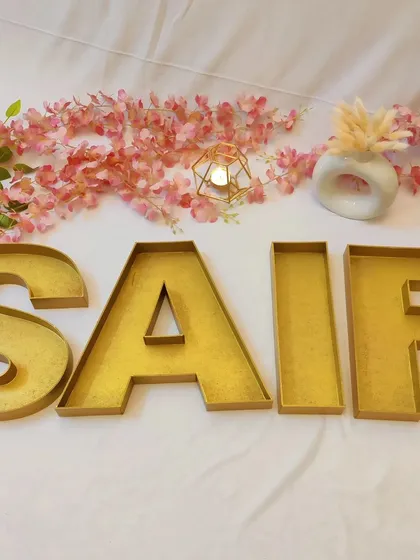 I love creating things that are both beautiful and useful. These large monogram letter trays, spelling out the name 'SAIF', are perfect for stylishly packing wedding favours or dry fruits for your guests.