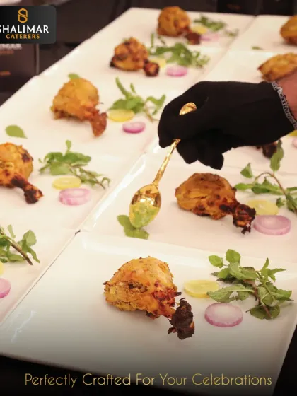 Every detail matters to us. Here, one of our staff members adds the final touch of green chutney to a tandoori chicken starter, showcasing the precision and care we put into every single plate.