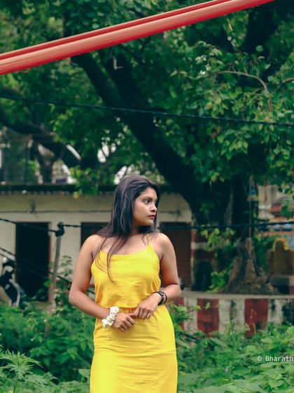 A candid, looking-away shot in an urban park setting. This style of photo tells a story and feels very authentic.