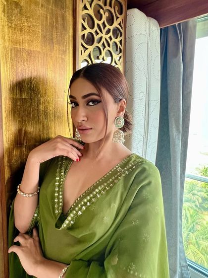 Another angle of our stunning mint green jhumkas, highlighting their movement and the way they catch the light.