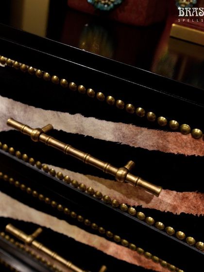 Our Bamboo T-knob used on drawers with a bold zebra print and nailhead trim at the JJ Valaya store. This shows how the handle can work in eclectic and maximalist design schemes.