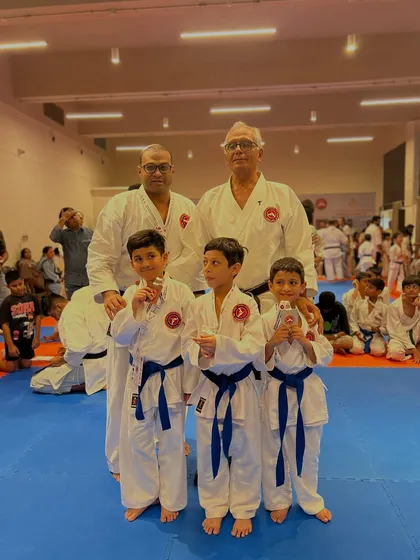 More of our young medalists with their Senseis. The collective success of our students is a reflection of the strong community and quality instruction at our dojo.