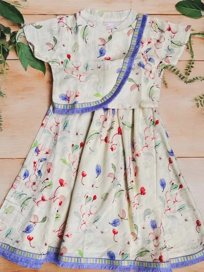 Step into a world of whimsy with our handloom cotton set, adorned with delicate blooms and a touch of playful purple fringe.