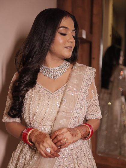 A closer look at the reception makeup. Softly defined eyes, a flawless base, and a neutral lip color create a sophisticated and timeless bridal look.