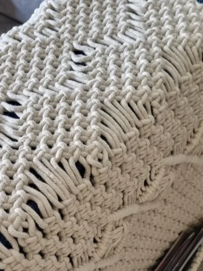 The back of the wall pocket, showing the clean and consistent knot work that gives the piece its structure and durability.